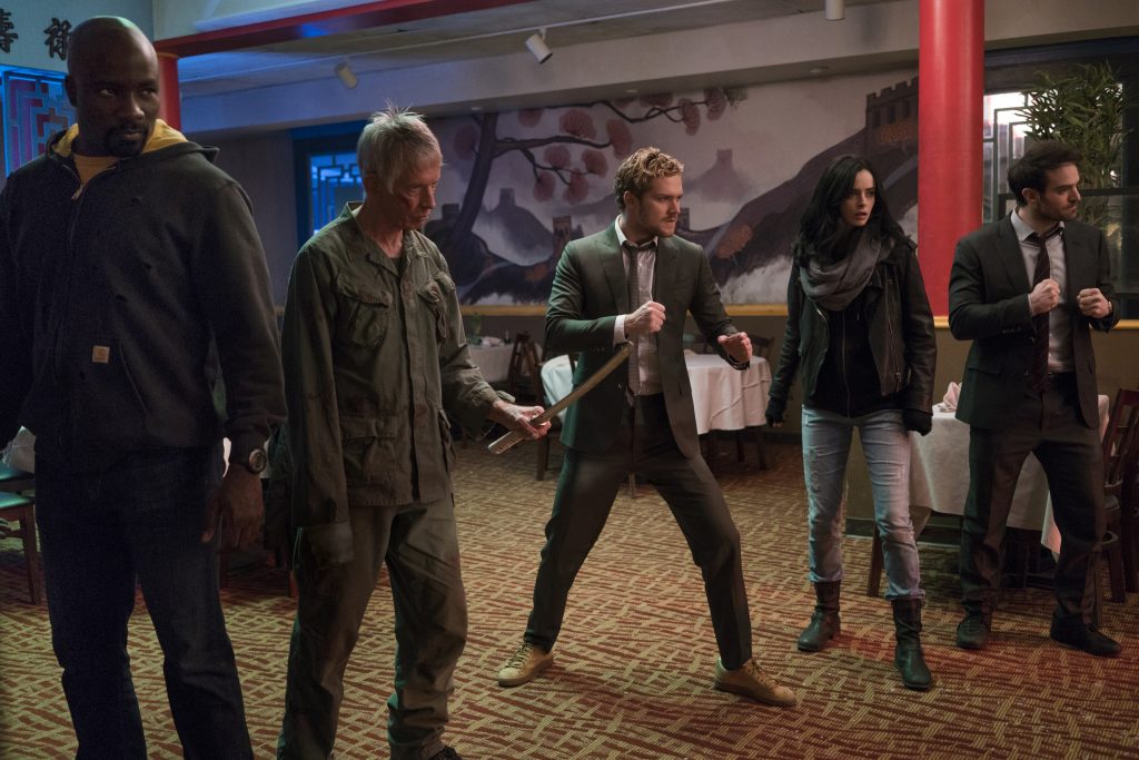 The Defenders fight in a restaurant